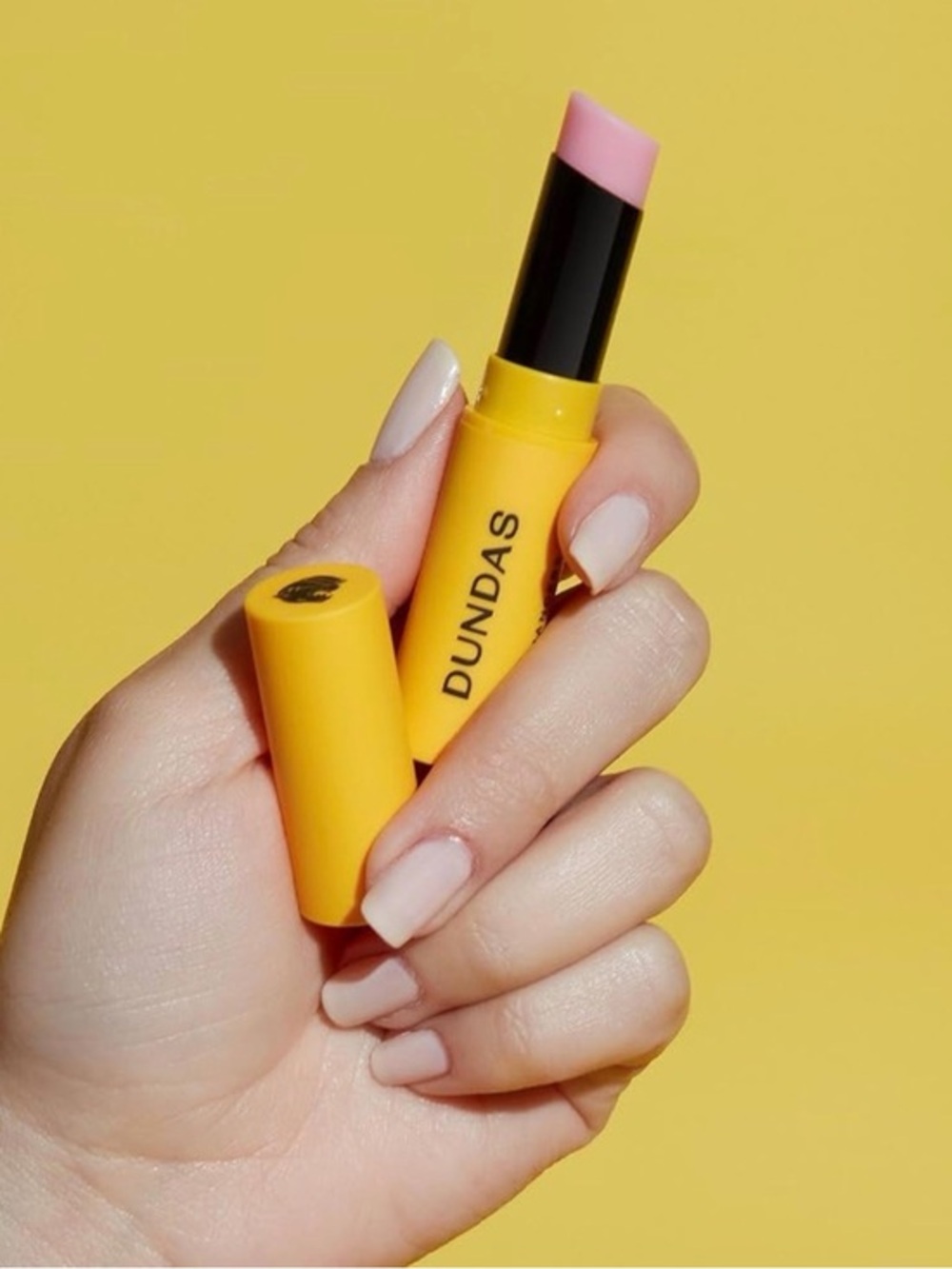 DUNDAS Soft Pink Lip Balm Stick in Yellow Tube